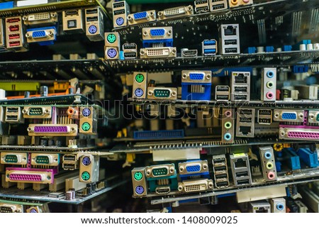 Planned obsolescence concept. Digital trash. Many computer motherboards unused.  Modern built-in obsolescence, unfashionable, no longer functional. Anti-consumerism concept. Royalty-Free Stock Photo #1408009025