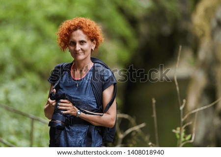 Closeup of a woman hiker and nature photographer