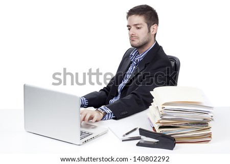 Businessman working on a laptop while at work