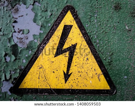 Electricity sign/symbol in a an old factory