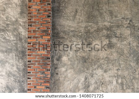 Red brick texture on crack concrete wall.