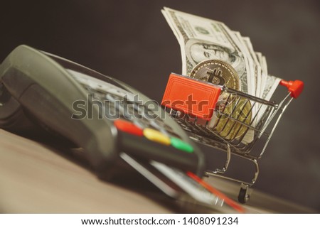 money bitcoin and credit card device economy concept