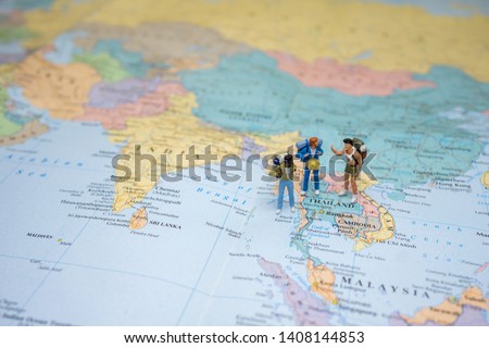 gay group or friends travel concepts. A little figure of friends backpacker or miniature gay group tourist LGBTQ stand and walk on map of Thailand in world map. Royalty-Free Stock Photo #1408144853