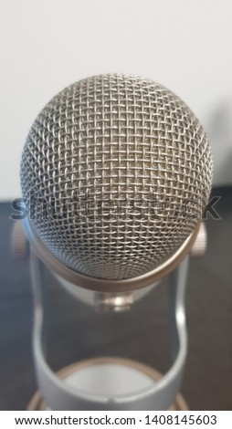 Voiceover microphone tilted, soft focus