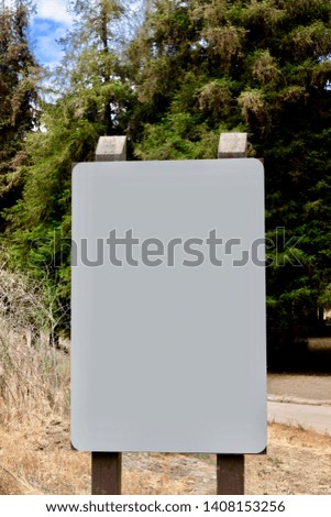 blank white sign in forest 