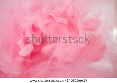Acrylic colors and ink in water. Abstract background, Cloud of silky ink in water on white isolated background, Ink drop in water, pink ink splash