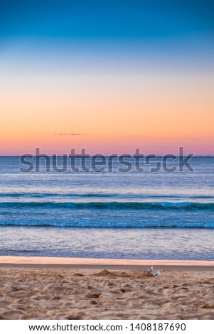 Beautiful sunset at the beach in Hastings Street, Noosa on the Sunshine Coast, Queensland, Australia