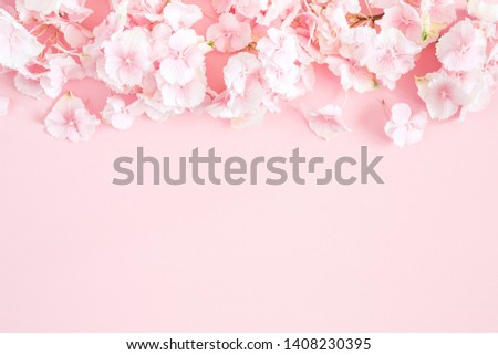 Flowers composition. Pink and white flowers on pastel pink background. Flat lay, top view, copy space