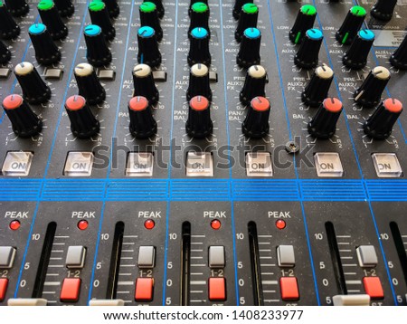 Close up professional audio DJ's turn table mixer console sound equipment.