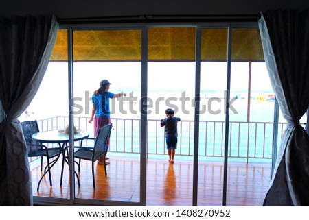 Mother with son on balcony