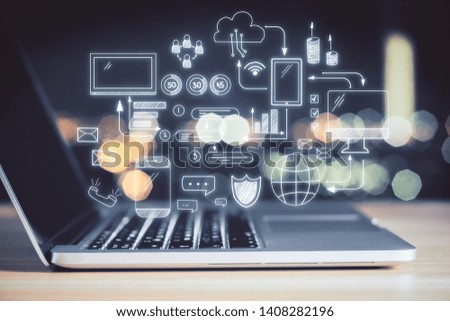Close up of laptop with social media sketch on blurry background. Technology and communication concept. Double exposure 
