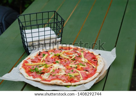 fresh pizza with tomatoes and sausage