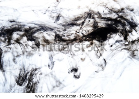 black ink dissolving in water