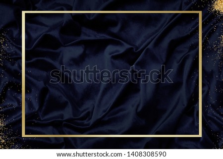 Gold frame on a silky navy blue fabric textured background illustration