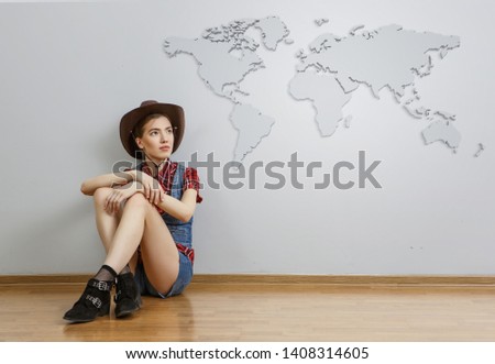Smiling young beautiful woman sitting on the floor. Mixed media