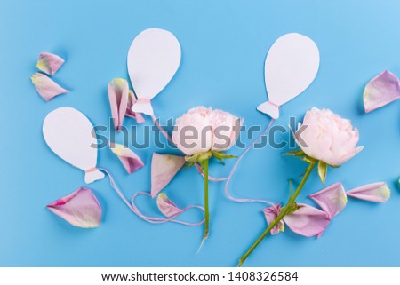 air balloons and flowers on blue background