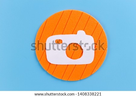 paper art of camera on blue background