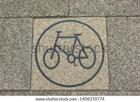 Cycle sign on a paving stone