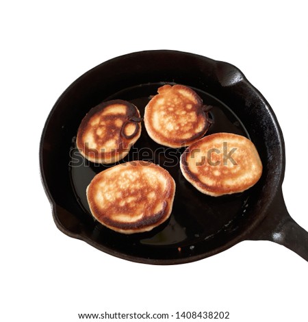 Isolated photo image of a pancake in a frying pan.