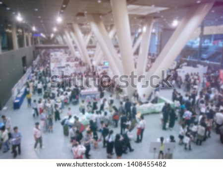 blurred photo of people gather in the trade show, seminar , expo which is big event in the city. top view photo.