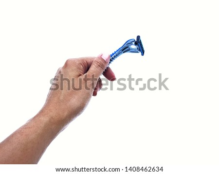 ็Hand holding razor on white background