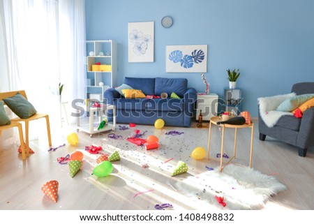 Room in terrible mess after party Royalty-Free Stock Photo #1408498832