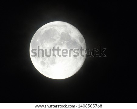 Picture of the moon on black background. Visible craters and detail.