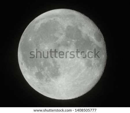 Picture of the moon on black background. Visible craters and detail.