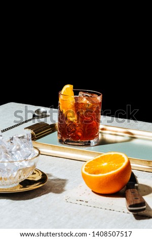 Negroni, an italian cocktail, an apéritif, first mixed in Florence, Italy, in 1919. Count Camillo Negroni asked to strengthen his Americano by adding gin rather than normal soda water. Royalty-Free Stock Photo #1408507517