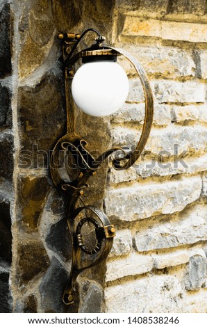 Beautiful wall lamp with wrought iron elements