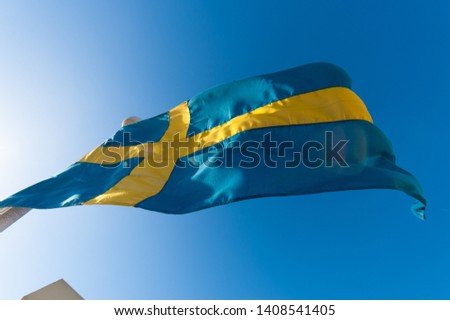 Swedish flag blowing in the wind.