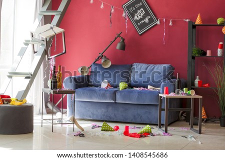 Room in terrible mess after party Royalty-Free Stock Photo #1408545686
