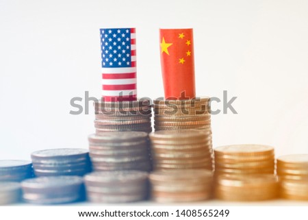 USA flag and China flag on coins stacking graph for tariff trade war between United States and China who conflict because of increase tax barrier of import and export product. Government and business.