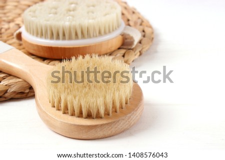Brush for dry massage on a light background.
