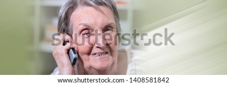 Senior woman using her phone. panoramic banner