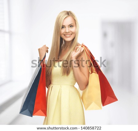 picture of happy woman with shopping bags