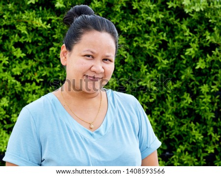 Portrait of attractive happy young asian female outdoor sunny day