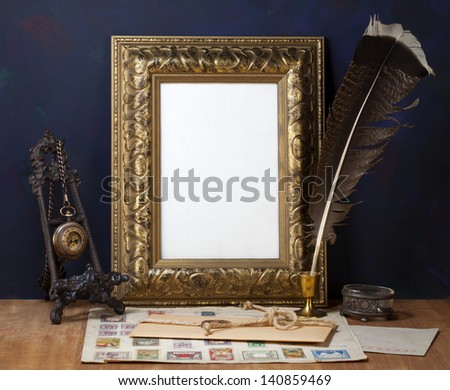 Old letters , vintage frame and a quill pen