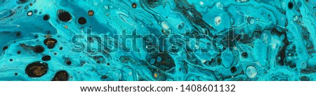 photography of abstract marbleized effect background. Blue creative colors. Beautiful paint with the addition of gold. banner