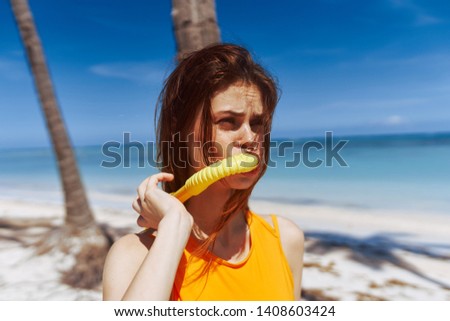 Cute woman in a yellow swimsuit tube for diving vacation travel sun tropics