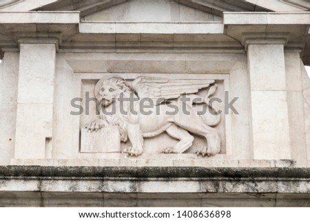 Bergamo, Italy. The Lion of Saint Mark in Porta San Giacomo, a winged lion holding a Bible symbol of the city of Venice and the Venetian Republic
