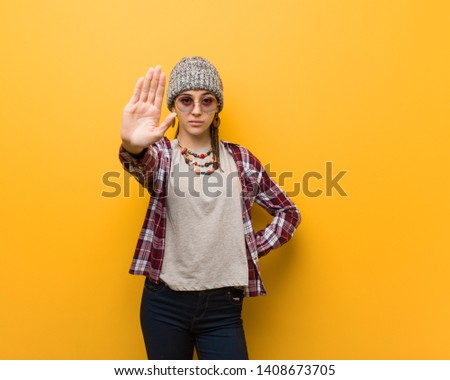 Young hippie natural woman putting hand in front