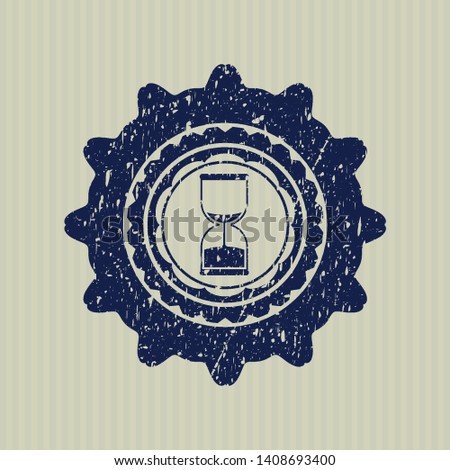 Blue sand clock icon inside distressed grunge seal