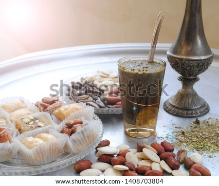 nuts and mate tea for the Ramadan celebration. Eastern traditions and customs Royalty-Free Stock Photo #1408703804