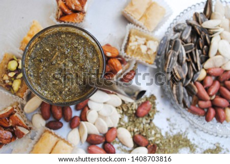 nuts and mate tea for the Ramadan celebration. Eastern traditions and customs Royalty-Free Stock Photo #1408703816