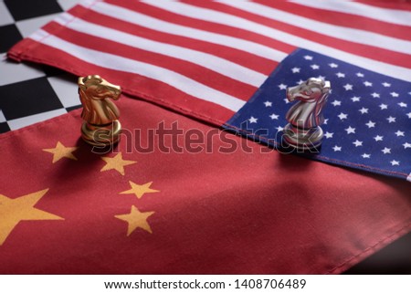 Chess game, two knights face to face on China and US national flags. Trade war concept. Conflict between two big countries, USA and China concept. Copy space. Royalty-Free Stock Photo #1408706489