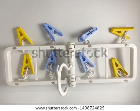 colorful plastic cloth clips hanger set for travelling Royalty-Free Stock Photo #1408724825