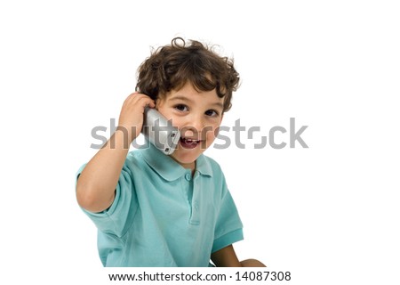 young boy talking on the phone isolated on white