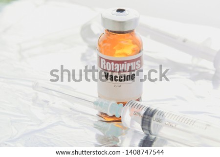 Open vial rotavirus vaccine vial on white background Royalty-Free Stock Photo #1408747544