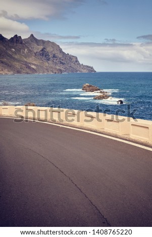 Vintage toned picture of a scenic ocean drive road, Tenerife, Spain.